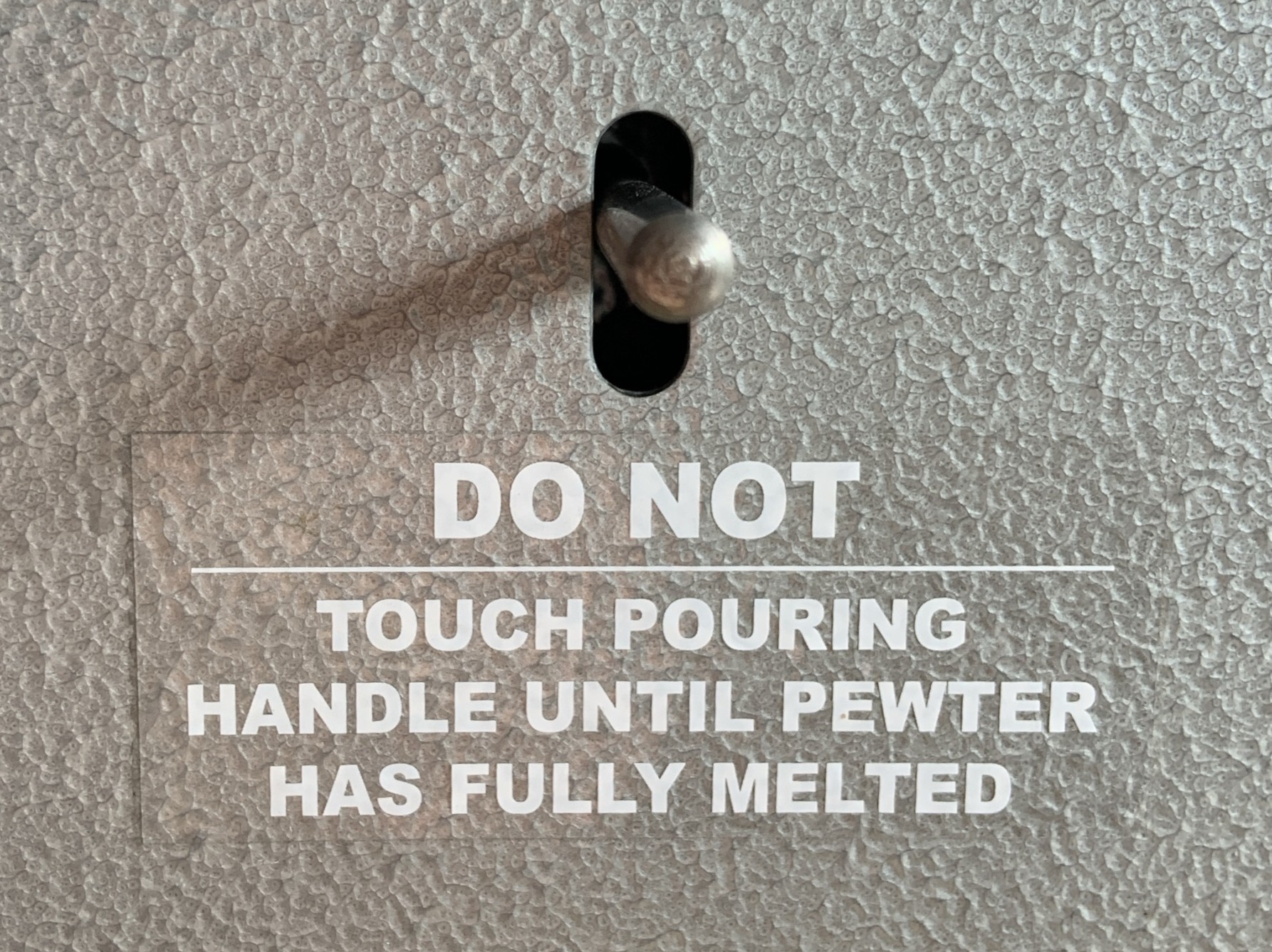 Caster pouring lever