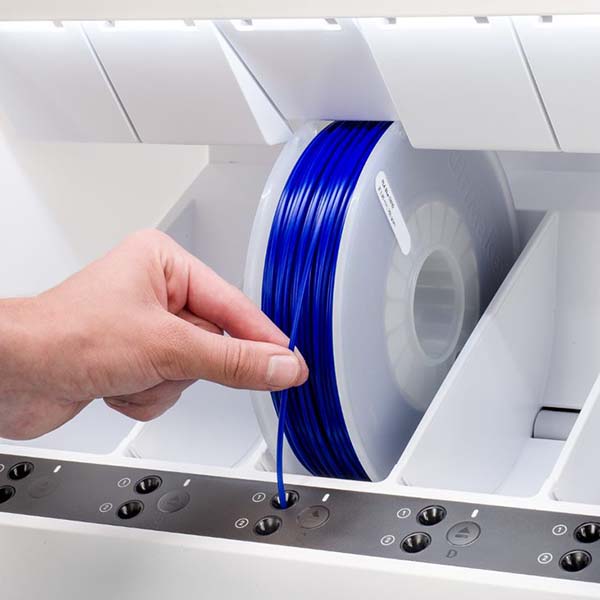 Feeding filament into materials station