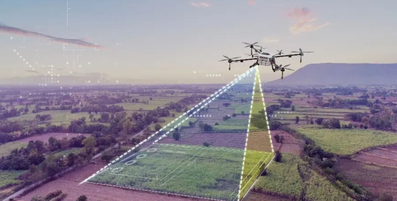 Drone flying over a field